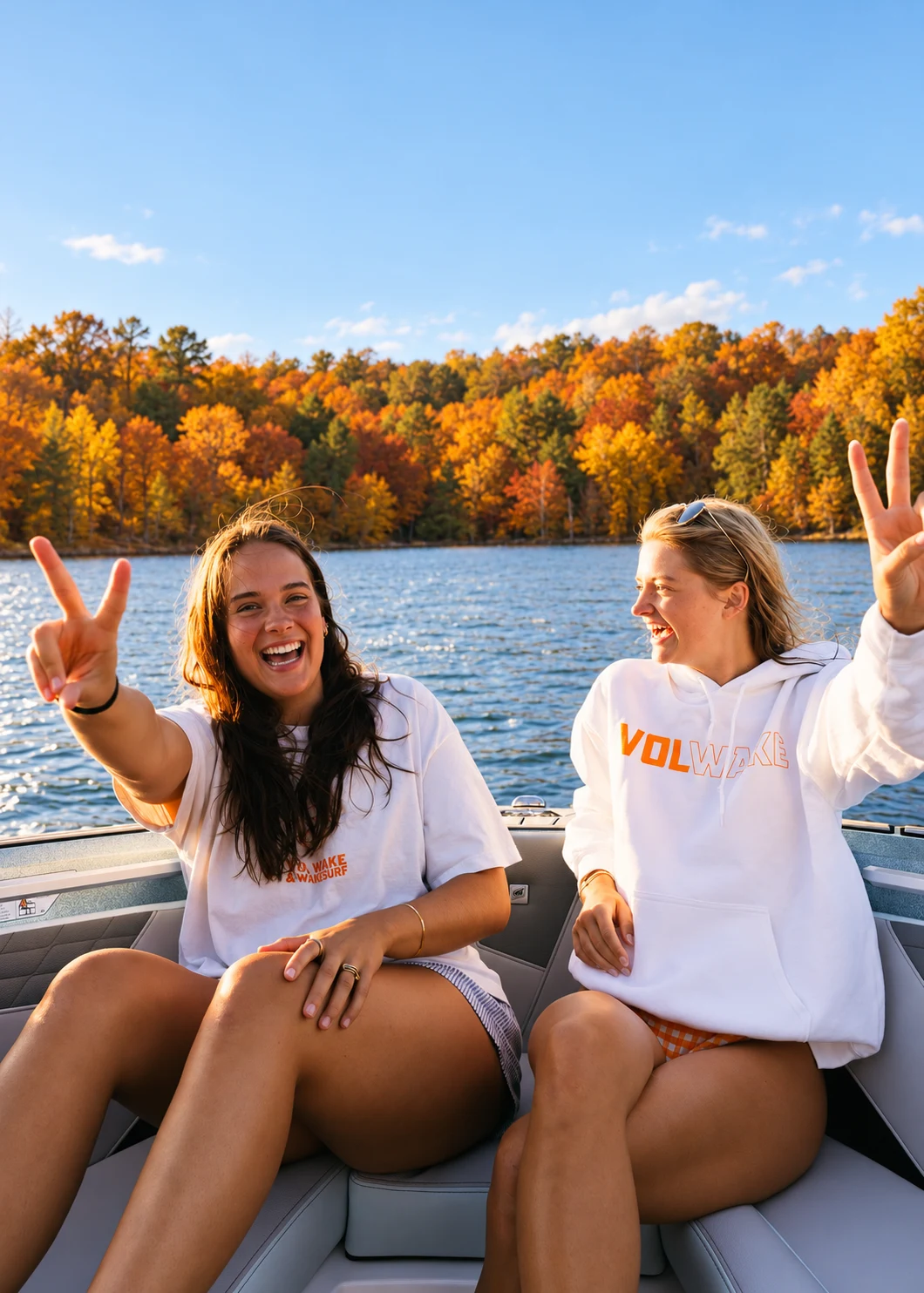 Two smiling guests together in warm fall afternoon light.